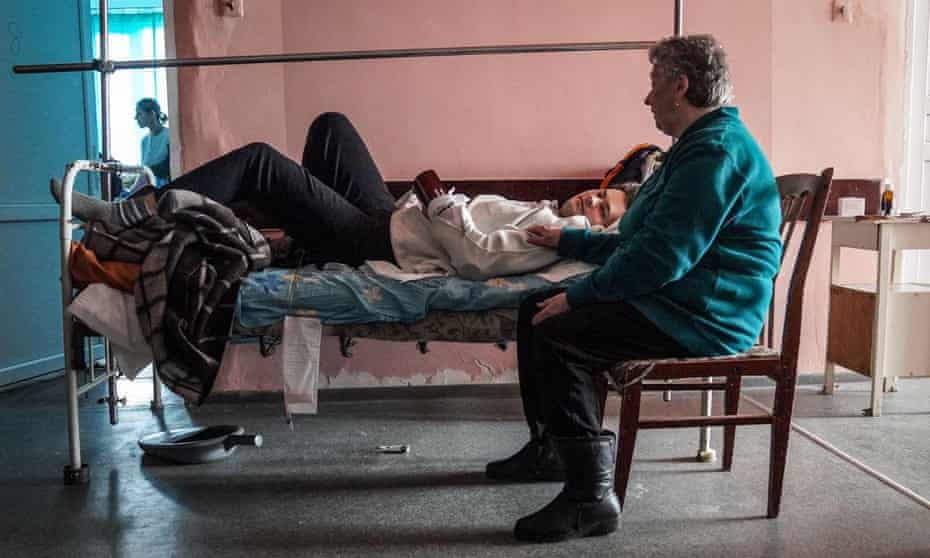 Nikita in hospital with his grandmother, Larysa, in Severodonetsk