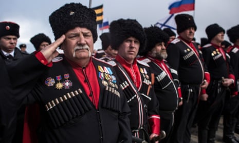 Cossacks mark the first anniversary of Russia’s annexation of the Crimea. 