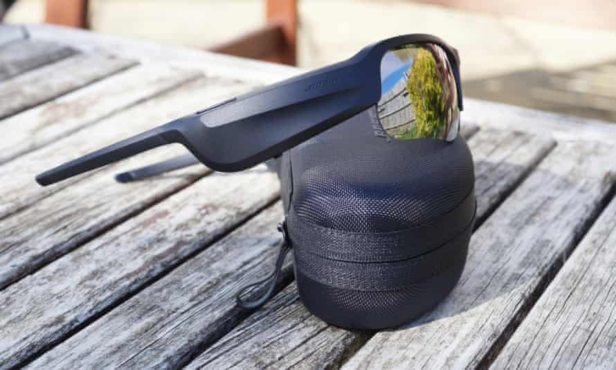A pair of Bose Frames Tempo sunglasses sitting on their nylon case.