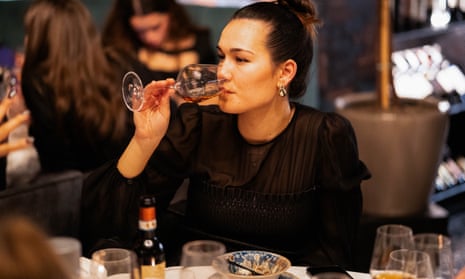 Woman drinking wine in a restaurant