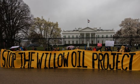 Protesters outside the White House with banner reading stop the willow oil project