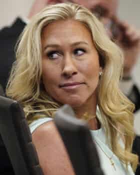 Marjorie Taylor Greene sits in the courtroom.