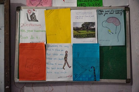 Posters made by girls in the 10th to 12th grades hang in a classroom at Ashna private school in Kandahar.