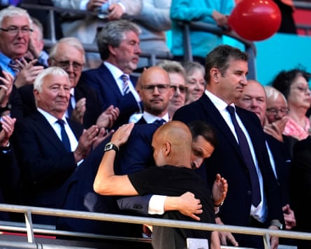 Khaldoon al-Mubarak hugs manager Pep Guardiola after Manchester City’s FA Cup final defeat.