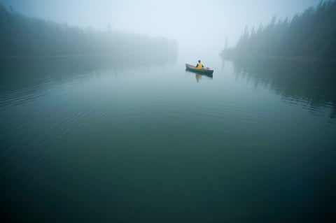 Canoeist on a lake