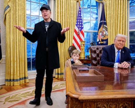Elon Musk and his son join Donald Trump in the Oval Office as Trump signs an executive order implementing the ‘department of government efficiency’ (Doge) department on 11 February.