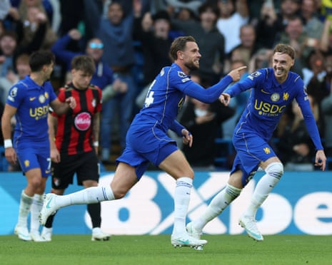 Jordan Henderson and Cole Palmer celebrate a Chelsea goal, smiling and pointing