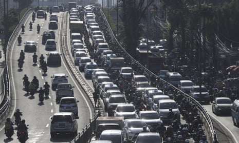 Vehicles are caught in a congestion during a rush hour in Jakarta, Indonesia