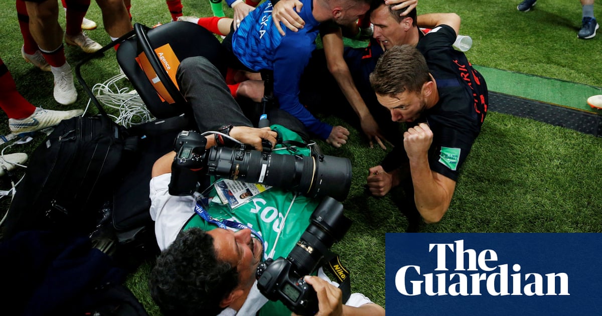 Photographer proves a good shot after getting squashed by Croatia players