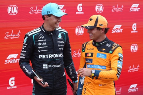 Mercedes’ George Russell celebrates winning the sprint race with McLaren’s Lando Norris
