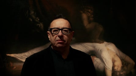 Waldemar Januszczak in front of a painting