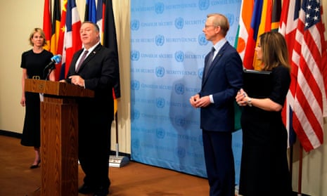 Mike Pompeo is flanked by the US ambassador to the United Nations, Kelly Craft, and US special representative for Iran, Brian Hook, as he speaks to reporters following a meeting with members of the UN security council.