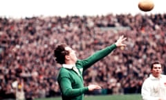 Tony O’Reilly throws a rugby ball while playing for Ireland.