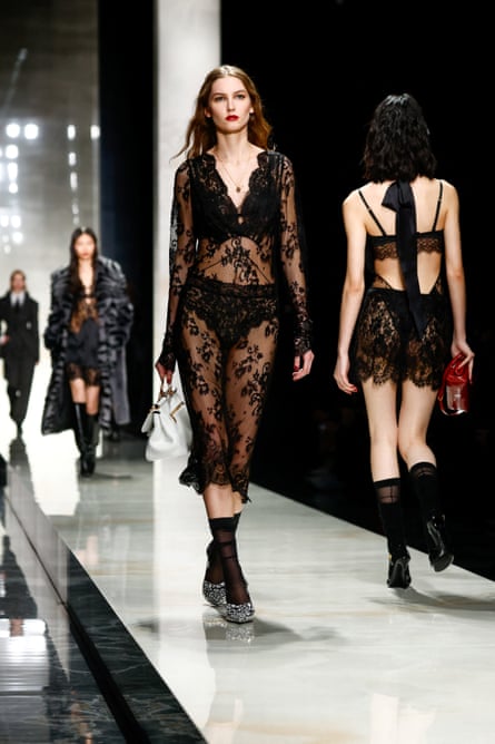 Models displaying their underwear under sheer lace dresses