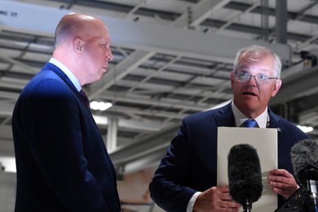 Defence minister Peter Dutton and Morrison take questions at a press conference after visiting TAE Aerospace near Ipswich, west of Brisbane, in the seat of Blair.