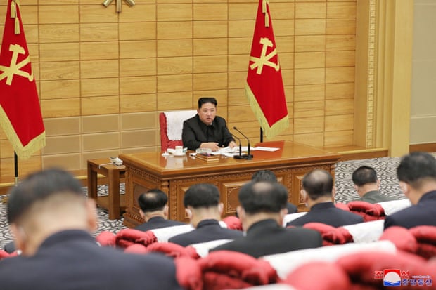 A North Korean state media supplied image of Kim Jong-un speaking at a politburo meeting about the country’s coronavirus outbreak on Saturday.