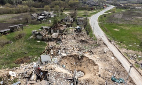 A crater and destroyed homes in the village of Yatskivka, eastern Ukraine, on 16 April 2022.