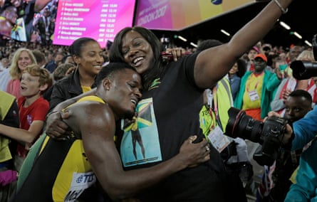 McLeod celebrates victory with his mother who is wearing a t-shirt bearing his picture.
