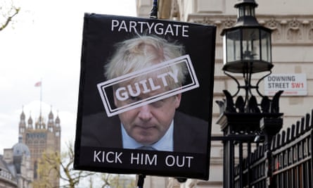 A placard calling for the resignation of the PM outside the entrance to 10 Downing Street, 13 April 2022.