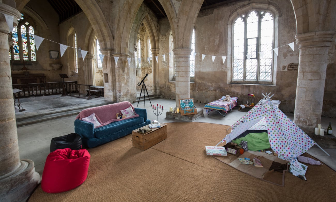 ‘Champing’ at All Saints, Aldwincle, Northamptonshire, beds made up on the floor, sunlight streaming through the windows.