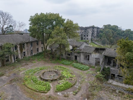abandoned, ruined buildings overgrown with plants