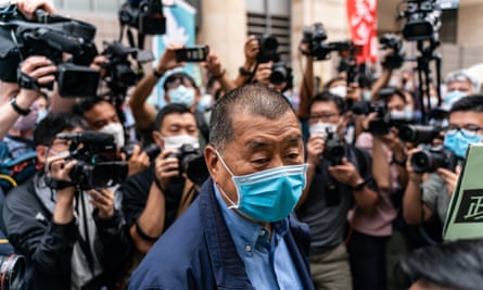 Hong Kong media tycoon Jimmy Lai arrives at the West Kowloon magistrates court