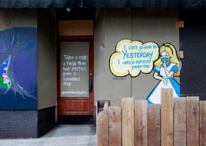 “Alice in Wonderland” inspired mural by artist Debora Spencer seen in the Belltown neighborhood.