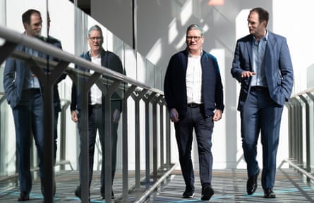 Keir Starmer and former Tory MP Dan Poulter walking alongside a mirror showing their reflection