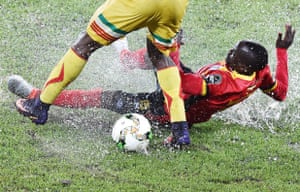 Uganda’s defender Godfrey Walusimbi challenges Mali’s midfielder Yves Bissouma in Oyem