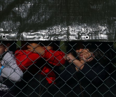 Children seen behind a fence at Manston in October 2022.