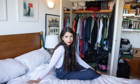Sirin Kale prepares for her layering challenge in front of her wardrobe. 