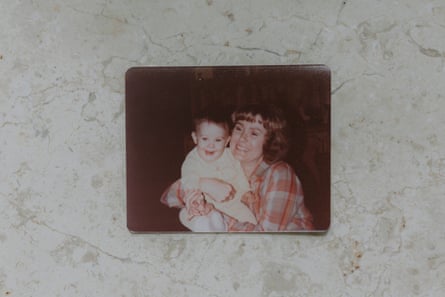 A woman embraces her toddler child