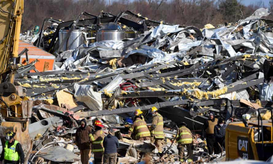 Rescue workers search what remains of the Mayfield Consumer Products candle factory in Kentucky
