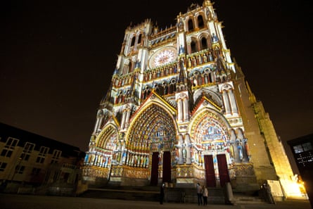Amiens cathedral lit up at night.