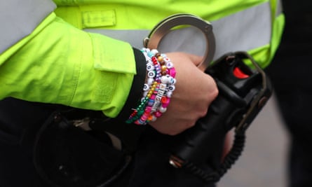 A police officer wears a friendship bracelet at the Taylor Swift concert.