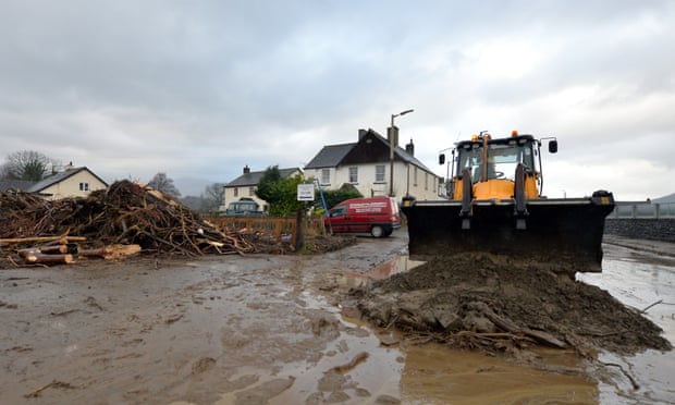 Flood debris is moved off the road in Keswick after December’s floods.