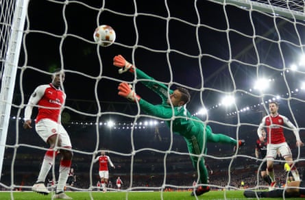 Danny Welbeck nods past the despairing Gianluigi Donnarumma to seal Arsenal’s victory.