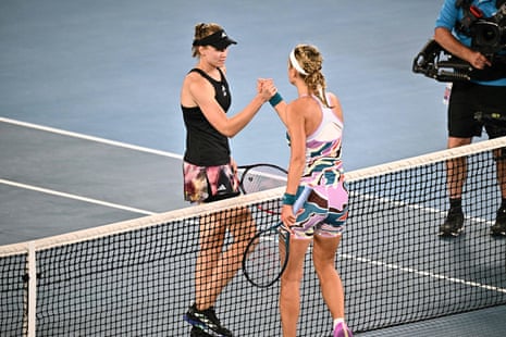 The players shake hands at the net as Rybakina goes through to the final.