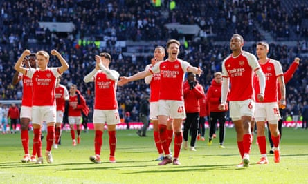 Arsenal players, with Declan Rice in the middle, celebrate winning at Tottenham