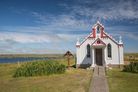 White church in a remote area surrounded by countryside