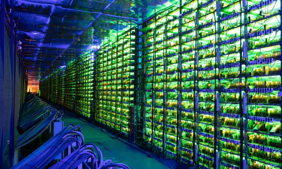 Illuminated mining rigs at the Minto cryptocurrency mining centre in Nadvoitsy, Russia.