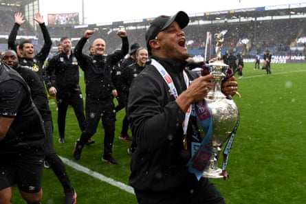 Vincent Kompany celebrates with the trophy after Burnley’s final game of the season at Turf Moor