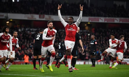 Danny Welbeck celebrates after opening the scoring for Arsenal moments before half-time.