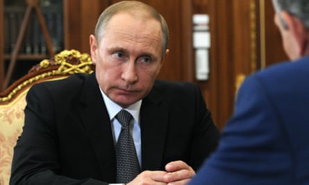Russian President Vladimir Putin, left, listens during a meeting in Moscow’s Kremlin, Russia, on Wednesday, Aug. 3, 2016. (Mikhail Klimentyev/Sputnik, Kremlin Pool Photo via AP)