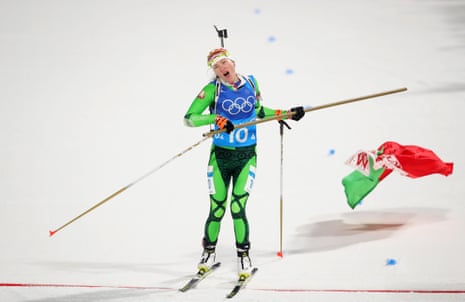 Darya Domracheva, but not the Belarus flag, crosses the finish line.
