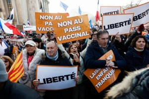 People attend a demonstration called by French nationalist party Les Patriotes to protest against a bill that would transform France’s current coronavirus health pass into a “vaccine pass”.