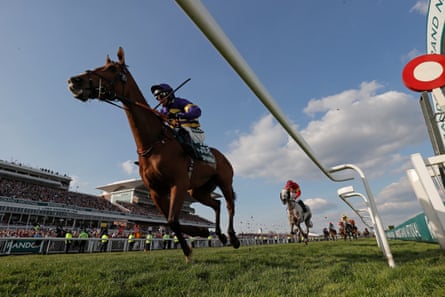 Corach Rambler with Derek Fox on board pass the winning post to win the Grand National during racing on day three of the Grand National jump racing festival at Aintree Racecourse.