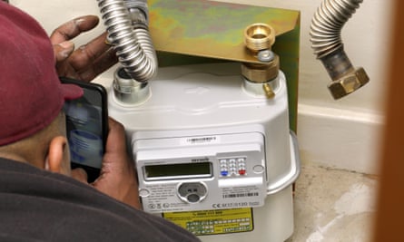 Unidentified installer fitting a new gas smart meter