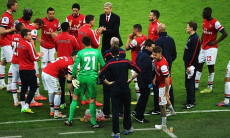 Arsène Wenger gives a team talk before the 2014 semi-final shootout with Wigan Athletic. The match finished 1-1 and Arsenal won the shootout 4-2.