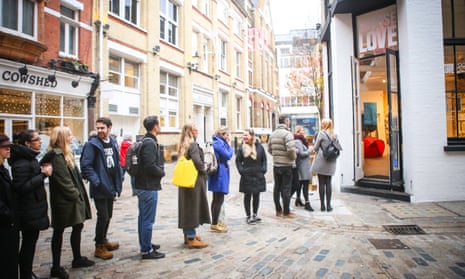 People queueing outside store off Carnaby Street